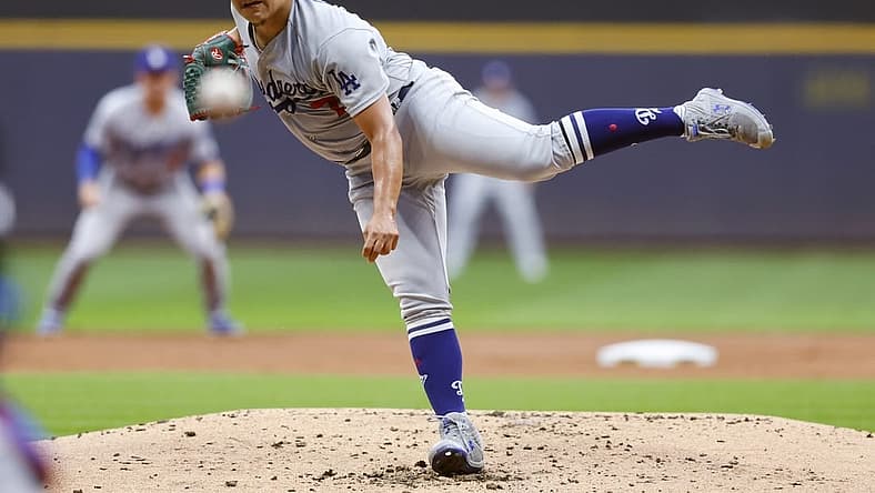 Aug 15, 2022; Milwaukee, Wisconsin, USA;  Los Angeles Dodgers pitcher Julio Urias (7) throws a pitch during the first inning against the Milwaukee Brewers at American Family Field. Mandatory Credit: Jeff Hanisch-USA TODAY Sports