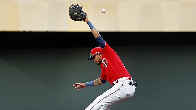 Aug 15, 2022; Minneapolis, Minnesota, USA; Minnesota Twins first baseman Luis Arraez (2) misses a single by Kansas City Royals catcher Salvador Perez (not pictured) in the first inning at Target Field. Mandatory Credit: Bruce Kluckhohn-USA TODAY Sports