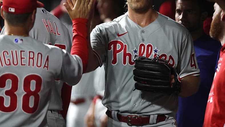 Aug 15, 2022; Cincinnati, Ohio, USA; Philadelphia Phillies starting pitcher Noah Syndergaard (43) reacts with teammates in the dugout after leaving the game in the eighth inning at Great American Ball Park. Mandatory Credit: David Kohl-USA TODAY Sports