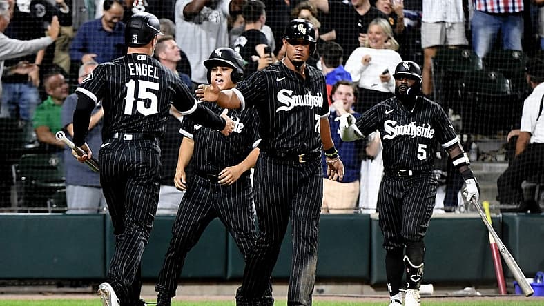 Aug 15, 2022; Chicago, Illinois, USA;  Chicago White Sox first baseman Jose Abreu (79) high fives Chicago White Sox center fielder Adam Engel (15)after they score against the Houston Astros during the eighth inning at Guaranteed Rate Field. Mandatory Credit: Matt Marton-USA TODAY Sports