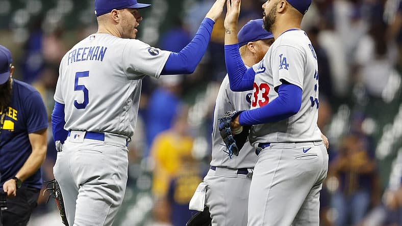 Aug 15, 2022; Milwaukee, Wisconsin, USA;  Los Angeles Dodgers first baseman Freddie Freeman (5) high fives pitcher David Price (33) following the game against the Milwaukee Brewers at American Family Field. Mandatory Credit: Jeff Hanisch-USA TODAY Sports