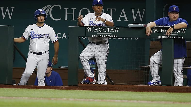 Aug 15, 2022; Arlington, Texas, USA; Texas Rangers interim manager Tony Beasley (27) watches the game in the eighth inning against the Oakland Athletics at Globe Life Field. Mandatory Credit: Tim Heitman-USA TODAY Sports