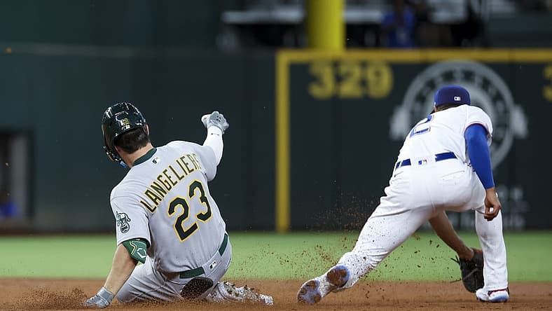 Aug 16, 2022; Arlington, Texas, USA; Oakland Athletics catcher Shea Langeliers (23) hits a double for his first major league hit during the second inning against the Texas Rangers at Globe Life Field. Mandatory Credit: Kevin Jairaj-USA TODAY Sports