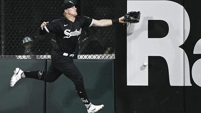 Aug 16, 2022; Chicago, Illinois, USA; Chicago White Sox right fielder Andrew Vaughn (25) tries to make a play on the ball hit by Houston Astros first baseman Yuli Gurriel (not pictured) during the third inning at Guaranteed Rate Field. Mandatory Credit: Matt Marton-USA TODAY Sports