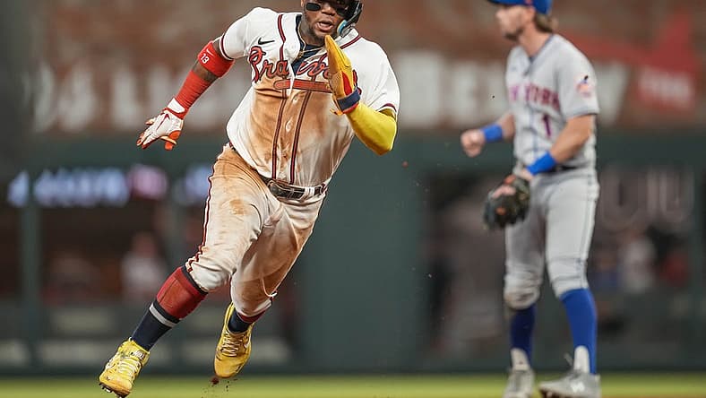 Aug 16, 2022; Cumberland, Georgia, USA; Atlanta Braves right fielder Ronald Acuna Jr. (13) runs before scoring a run against the New York Mets during the seventh inning at Truist Park. Mandatory Credit: Dale Zanine-USA TODAY Sports