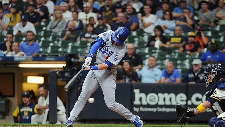 Aug 16, 2022; Milwaukee, Wisconsin, USA; Los Angeles Dodgers second baseman Gavin Lux (9) strikes out against the Milwaukee Brewers in the ninth inning at American Family Field. Mandatory Credit: Michael McLoone-USA TODAY Sports