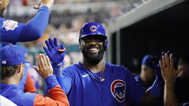 Aug 16, 2022; Washington, District of Columbia, USA; Chicago Cubs designated hitter Franmil Reyes (32) celebrates with teammates in the dugout after hitting a home run against the Washington Nationals during the sixth inning at Nationals Park. Mandatory Credit: Geoff Burke-USA TODAY Sports