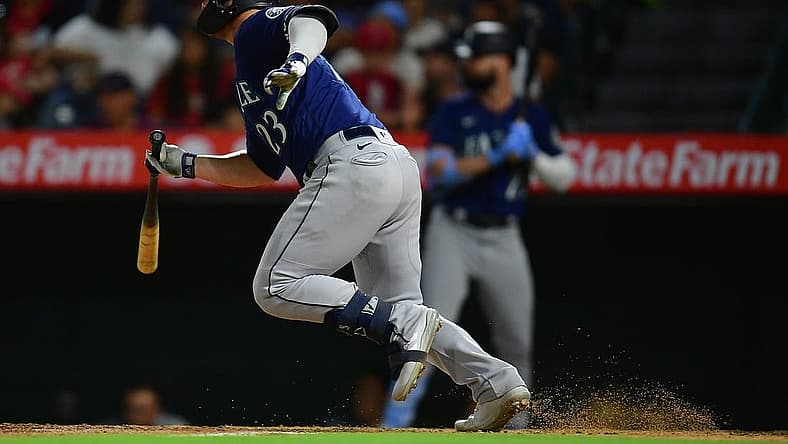 Aug 16, 2022; Anaheim, California, USA; Seattle Mariners first baseman Ty France (23) hits a two run RBI single against the Los Angeles Angels during the sixth inning at Angel Stadium. Mandatory Credit: Gary A. Vasquez-USA TODAY Sports