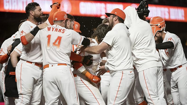 Aug 16, 2022; San Francisco, California, USA; San Francisco Giants shortstop Brandon Crawford (35) celebrates with team mates after hitting a walk off two-run home run during the ninth inning against the Arizona Diamondbacks at Oracle Park. Mandatory Credit: Ed Szczepanski-USA TODAY Sports
