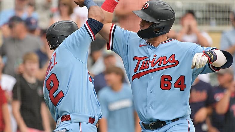 Aug 17, 2022; Minneapolis, Minnesota, USA; Minnesota Twins first baseman Jose Miranda (64) reacts with second baseman Luis Arraez (2) after hitting a home run off Kansas City Royals starting pitcher Daniel Lynch (not pictured) during the first inning at Target Field. Mandatory Credit: Jeffrey Becker-USA TODAY Sports