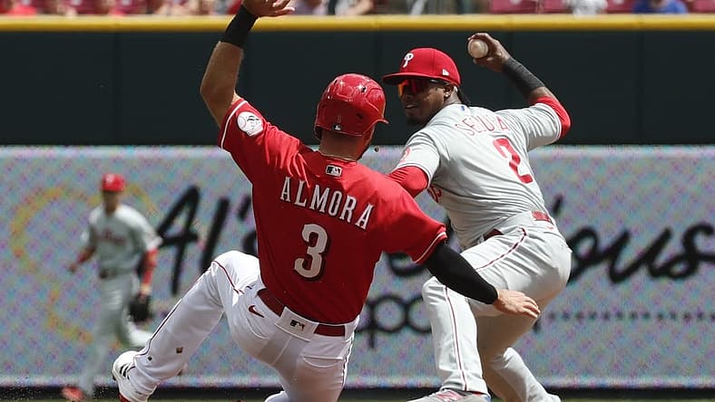 Aug 17, 2022; Cincinnati, Ohio, USA; Cincinnati Reds center fielder Albert Almora Jr. (3) is forced out at second by Philadelphia Phillies second baseman Jean Segura (2) during the second inning at Great American Ball Park. Mandatory Credit: David Kohl-USA TODAY Sports