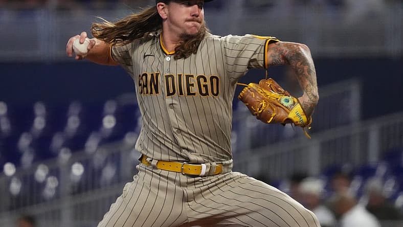 Aug 17, 2022; Miami, Florida, USA; San Diego Padres starting pitcher Mike Clevinger (52) delivers a pitch in the first inning against the Miami Marlins at loanDepot park. Mandatory Credit: Jasen Vinlove-USA TODAY Sports