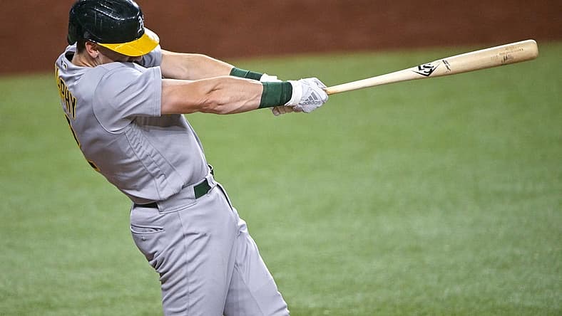 Aug 17, 2022; Arlington, Texas, USA; Oakland Athletics catcher Sean Murphy (12) hits a two run home run during the fourth inning against the Texas Rangers at Globe Life Field. Mandatory Credit: Jerome Miron-USA TODAY Sports