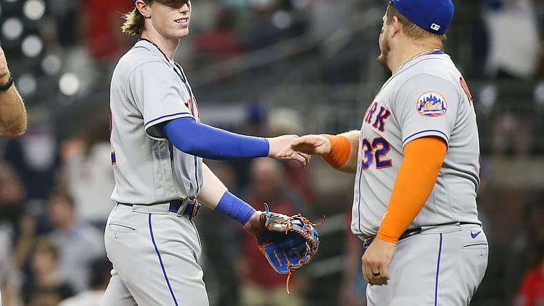 Aug 17, 2022; Atlanta, Georgia, USA; New York Mets third baseman Brett Baty (22) celebrates with designated hitter Daniel Vogelbach (32) after a victory against the Atlanta Braves at Truist Park. Mandatory Credit: Brett Davis-USA TODAY Sports