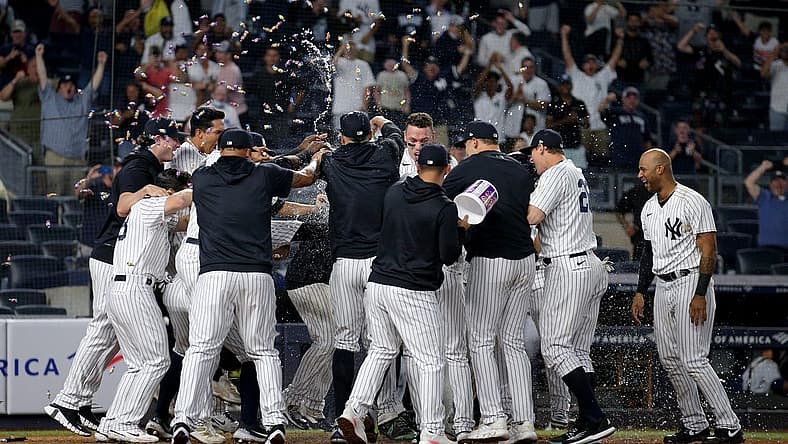 Aug 17, 2022; Bronx, New York, USA; New York Yankees designated hitter Josh Donaldson (not pictured) is met at home by teammates after hitting a game winning grand slam home run against the Tampa Bay Rays during the tenth inning at Yankee Stadium. Mandatory Credit: Brad Penner-USA TODAY Sports