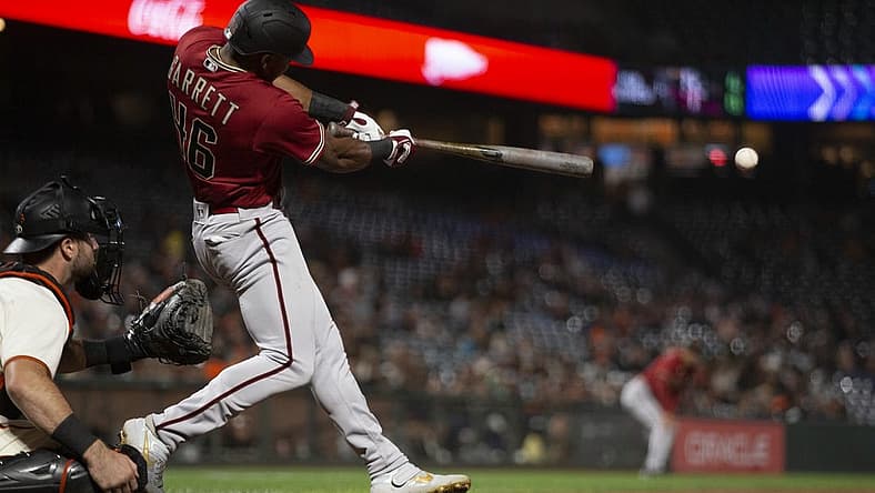 Aug 17, 2022; San Francisco, California, USA; Arizona Diamondbacks left fielder Stone Garrett (46) hits a double during the eighth inning at Oracle Park. Mandatory Credit: D. Ross Cameron-USA TODAY Sports