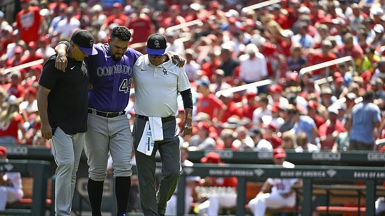 Aug 18, 2022; St. Louis, Missouri, USA; Colorado Rockies starting pitcher Antonio Senzatela (49) is helped off the field after injuring his leg while cover first base against the St. Louis Cardinals during the second inning at Busch Stadium. Mandatory Credit: Jeff Curry-USA TODAY Sports