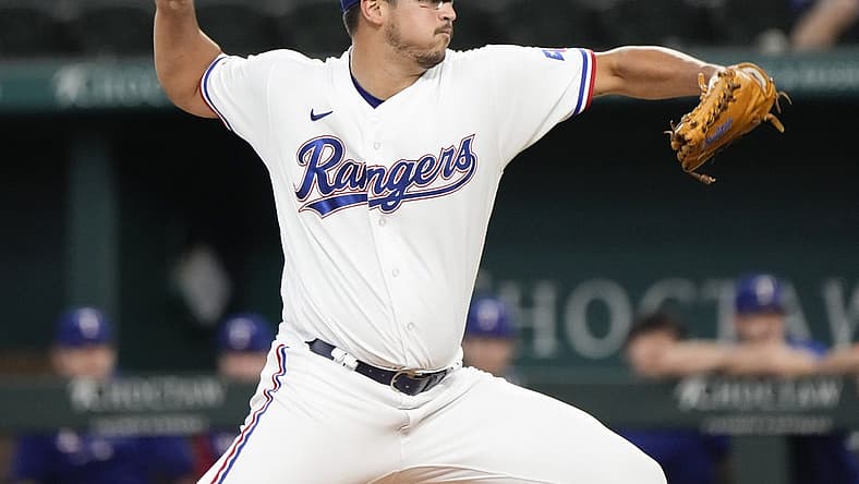 Aug 18, 2022; Arlington, Texas, USA; Texas Rangers starting pitcher Dane Dunning (33) delivers a pitch to the Oakland Athletics during the first inning at Globe Life Field. Mandatory Credit: Jim Cowsert-USA TODAY Sports