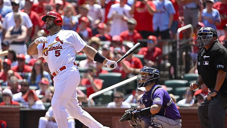 Aug 18, 2022; St. Louis, Missouri, USA; St. Louis Cardinals pinch hitter Albert Pujols (5) hits a grand slam for his 690th career home run against the Colorado Rockies during the third inning at Busch Stadium. Mandatory Credit: Jeff Curry-USA TODAY Sports