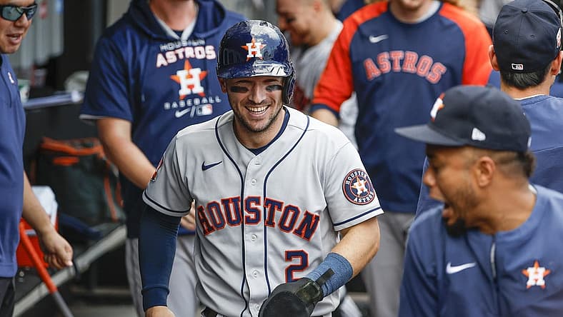 Aug 18, 2022; Chicago, Illinois, USA; Houston Astros third baseman Alex Bregman (2) celebrates in the dugout after scoring against the Chicago White Sox during the third inning at Guaranteed Rate Field. Mandatory Credit: Kamil Krzaczynski-USA TODAY Sports