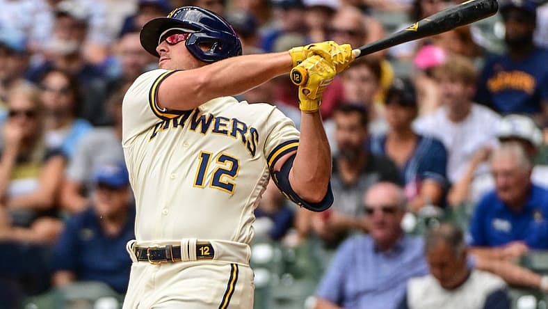 Aug 18, 2022; Milwaukee, Wisconsin, USA; Milwaukee Brewers right fielder Hunter Renfroe (12) hits a two-run home run in the fifth inning against the Los Angeles Dodgers at American Family Field. Mandatory Credit: Benny Sieu-USA TODAY Sports