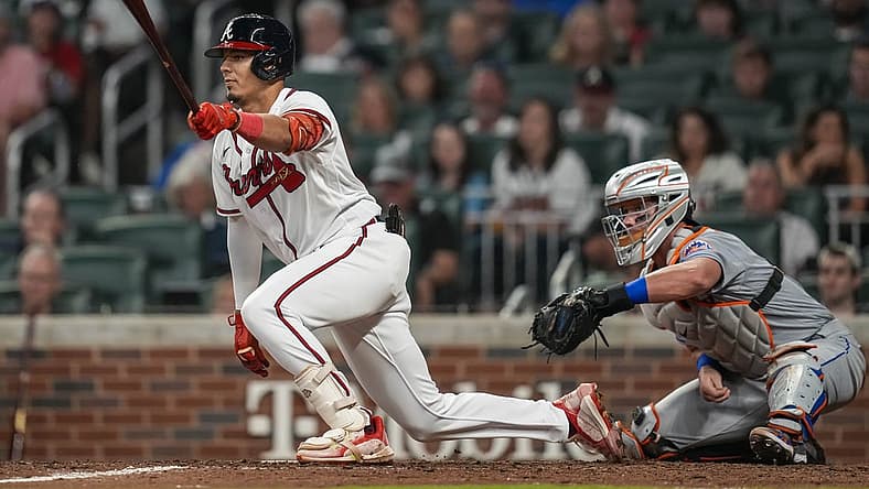 Aug 18, 2022; Cumberland, Georgia, USA; Atlanta Braves second baseman Vaughn Grissom (18) hits an infield single against the New York Mets during the seventh inning at Truist Park. Mandatory Credit: Dale Zanine-USA TODAY Sports