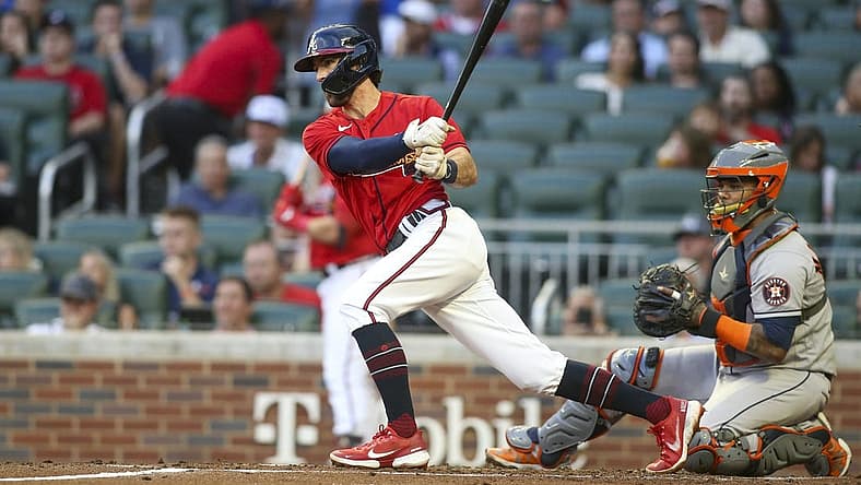 Aug 19, 2022; Atlanta, Georgia, USA; Atlanta Braves shortstop Dansby Swanson (7) hits a single against the Houston Astros in the first inning at Truist Park. Mandatory Credit: Brett Davis-USA TODAY Sports