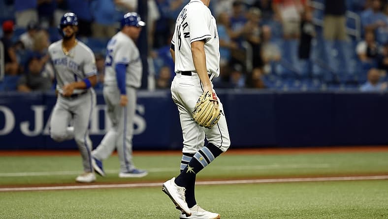 Aug 19, 2022; St. Petersburg, Florida, USA; Tampa Bay Rays starting pitcher Shane McClanahan (18) looks on as he gives up a two run home run against the Kansas City Royals during the third inning at Tropicana Field. Mandatory Credit: Kim Klement-USA TODAY Sports