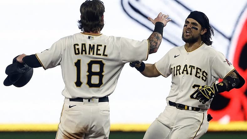 Aug 19, 2022; Pittsburgh, Pennsylvania, USA; Pittsburgh Pirates first baseman Michael Chavis (2) celebrates his game winning walk off single with right fielder Ben Gamel (18) to defeat the Cincinnati Reds during the ninth inning at PNC Park. The Pirates won 5-4. Mandatory Credit: Charles LeClaire-USA TODAY Sports