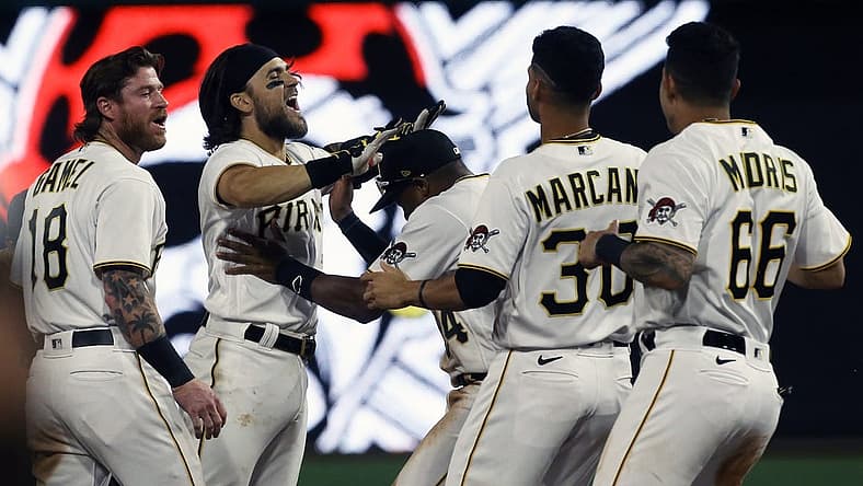 Aug 19, 2022; Pittsburgh, Pennsylvania, USA; Pittsburgh Pirates first baseman Michael Chavis (second from left) celebrates his game winning walk-off single with teammates to defeat the Cincinnati Reds during the ninth inning at PNC Park. The Pirates won 5-4. Mandatory Credit: Charles LeClaire-USA TODAY Sports