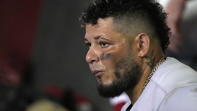 Aug 19, 2022; Phoenix, Arizona, USA; St. Louis Cardinals catcher Yadier Molina (4) watches from the dugout in the fourth inning against the Arizona Diamondbacks at Chase Field. Mandatory Credit: Rick Scuteri-USA TODAY Sports