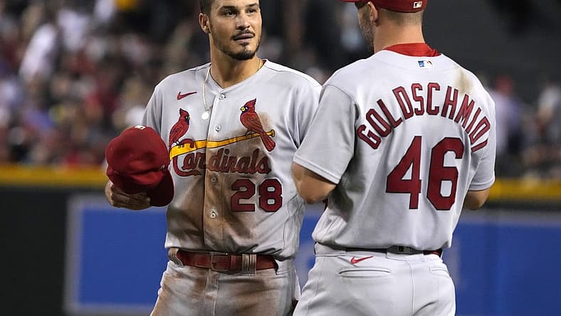 Aug 19, 2022; Phoenix, Arizona, USA; St. Louis Cardinals third baseman Nolan Arenado (28) talks to first baseman Paul Goldschmidt (46) in between innings against the Arizona Diamondbacks at Chase Field. Mandatory Credit: Rick Scuteri-USA TODAY Sports