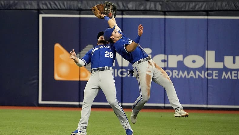 Aug 20, 2022; St. Petersburg, Florida, USA; Kansas City Royals left fielder Kyle Isbel (28) (left) and second baseman Michael Massey (19) (right) both reach for a fly ball hit by Tampa Bay Rays center fielder Jose Siri (22) in the fourth inning at Tropicana Field. Massey caught the ball. Mandatory Credit: Dave Nelson-USA TODAY Sports