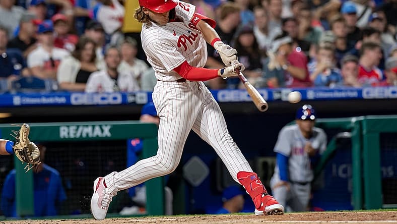 Aug 20, 2022; Philadelphia, Pennsylvania, USA; Philadelphia Phillies third baseman Alec Bohm (28) hits a two RBI double against the New York Mets during the third inning at Citizens Bank Park. Mandatory Credit: John Jones-USA TODAY Sports