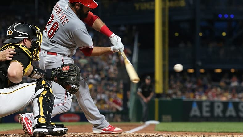 Aug 20, 2022; Pittsburgh, Pennsylvania, USA; Cincinnati Reds catcher Austin Romine (28) hits a two-run double against the Pittsburgh Pirates during the fourth inning at PNC Park. Mandatory Credit: Charles LeClaire-USA TODAY Sports