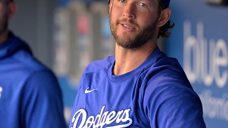 Aug 20, 2022; Los Angeles, California, USA;  Los Angeles Dodgers starting pitcher Clayton Kershaw (22) looks on from the dugout prior to a game against the Miami Marlins at Dodger Stadium. Mandatory Credit: Jayne Kamin-Oncea-USA TODAY Sports