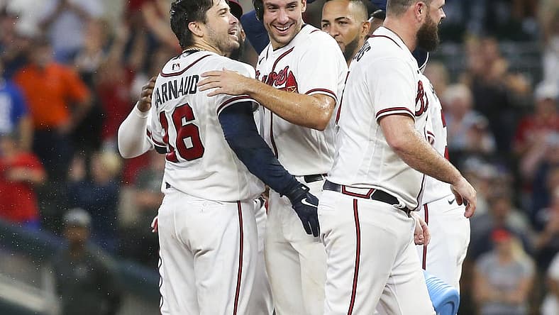 Aug 20, 2022; Atlanta, Georgia, USA; Atlanta Braves pinch hitter Travis d'Arnaud (16) celebrates after a walk-off single with first baseman Matt Olson (28) against the Houston Astros in the eleventh inning at Truist Park. Mandatory Credit: Brett Davis-USA TODAY Sports
