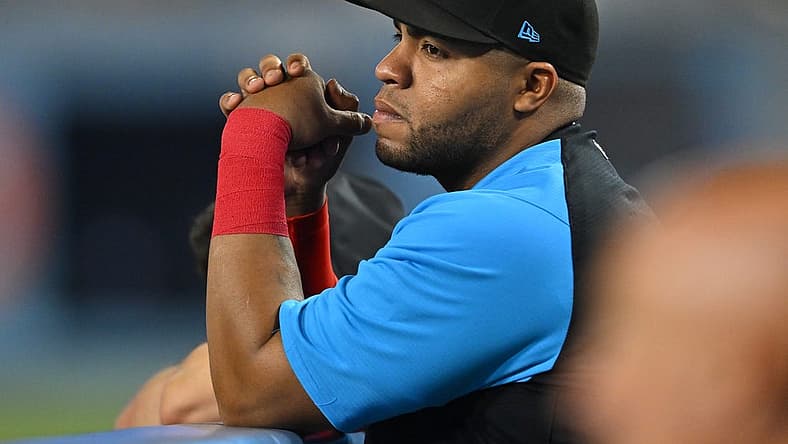 Aug 20, 2022; Los Angeles, California, USA; Miami Marlins first baseman Jesus Aguilar (99) looks on from the dugout during the game against the Los Angeles Dodgers at Dodger Stadium. Mandatory Credit: Jayne Kamin-Oncea-USA TODAY Sports
