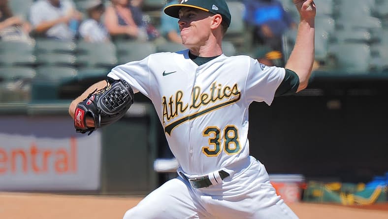 Aug 21, 2022; Oakland, California, USA; Oakland Athletics starting pitcher JP Sears (38) pitches the ball against the Seattle Mariners during the first inning at RingCentral Coliseum. Mandatory Credit: Kelley L Cox-USA TODAY Sports