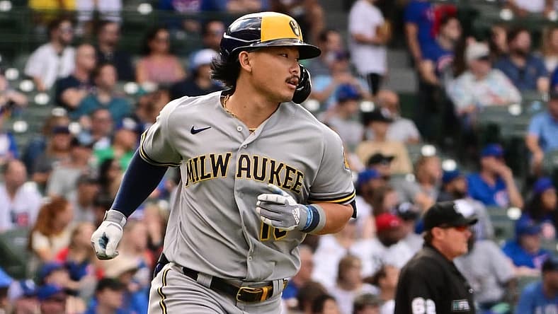 Aug 21, 2022; Chicago, Illinois, USA; Milwaukee Brewers designated hitter Keston Hiura (18) hits a two run home run in the ninth inning against the Chicago Cubs at Wrigley Field. Mandatory Credit: Quinn Harris-USA TODAY Sports