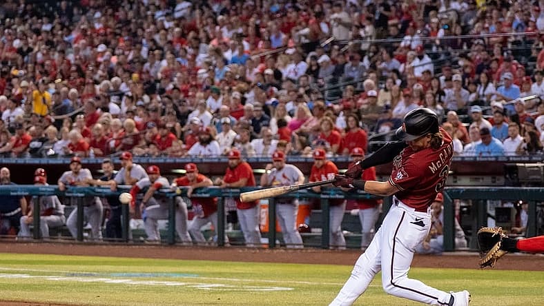 Aug 21, 2022; Phoenix, Arizona, USA; Arizona Diamondbacks outfielder Jake McCarthy (30) singles a line drive to the center during the second inning against the St. Louis Cardinals at Chase Field. Mandatory Credit: Allan Henry-USA TODAY Sports