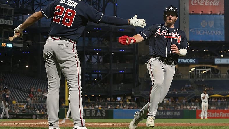 Aug 23, 2022; Pittsburgh, Pennsylvania, USA; Atlanta Braves first baseman Matt Olson (28) greets left fielder Robbie Grossman (right) after Grossman scored a run against the Pittsburgh Pirates during the fifth inning at PNC Park. Mandatory Credit: Charles LeClaire-USA TODAY Sports