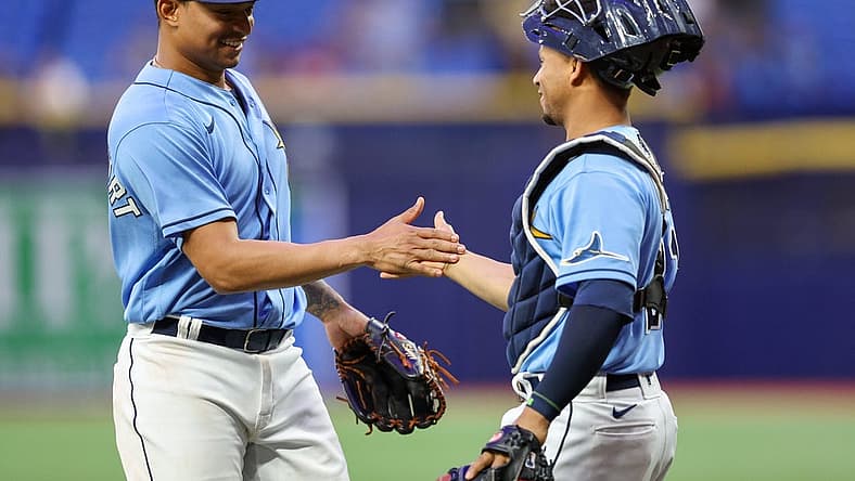 Aug 23, 2022; St. Petersburg, Florida, USA; Tampa Bay Rays catcher Francisco Mejia (21) congratulates catcher Christian Bethancourt (14) after pitching the ninth inning against the Los Angeles Angels at Tropicana Field. Mandatory Credit: Nathan Ray Seebeck-USA TODAY Sports