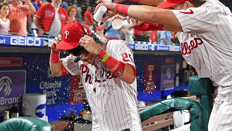 Aug 23, 2022; Philadelphia, Pennsylvania, USA; Philadelphia Phillies second baseman Nick Maton (29) has water dumped on by second baseman Bryson Stott (5) and first baseman Rhys Hoskins (17) after his walk-off single against the Cincinnati Reds during the ninth inning at Citizens Bank Park. Mandatory Credit: Eric Hartline-USA TODAY Sports