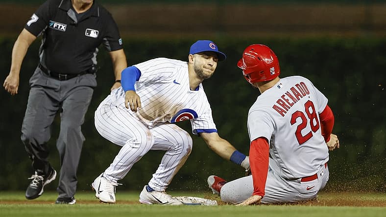 Aug 23, 2022; Chicago, Illinois, USA; Chicago Cubs second baseman Nick Madrigal (1) tags out St. Louis Cardinals third baseman Nolan Arenado (28) at second base during the eight inning of the second game of the doubleheader at Wrigley Field. Mandatory Credit: Kamil Krzaczynski-USA TODAY Sports