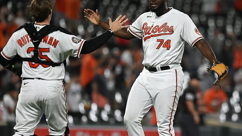 Aug 23, 2022; Baltimore, Maryland, USA; Baltimore Orioles relief pitcher Felix Bautista (74) celebrates with catcher Adley Rutschman (35) after the game against the Chicago White Sox at Oriole Park at Camden Yards. Mandatory Credit: Tommy Gilligan-USA TODAY Sports