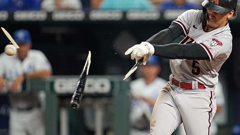 Aug 23, 2022; Kansas City, Missouri, USA; Arizona Diamondbacks center fielder Alek Thomas (5) breaks his bat as he hits a single against the Kansas City Royals during the sixth inning at Kauffman Stadium. Mandatory Credit: Jay Biggerstaff-USA TODAY Sports