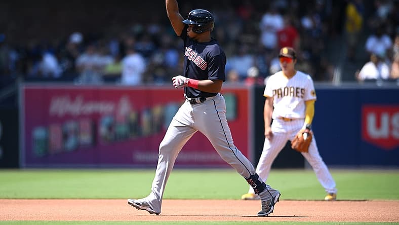 Aug 24, 2022; San Diego, California, USA; Cleveland Guardians right fielder Oscar Gonzalez (left) gestures while rounding the bases after hitting a home run against the San Diego Padres during the fourth inning at Petco Park. Mandatory Credit: Orlando Ramirez-USA TODAY Sports