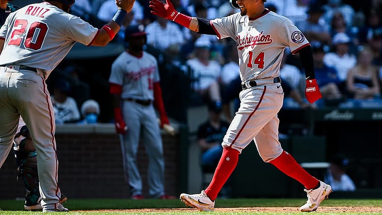 Aug 24, 2022; Seattle, Washington, USA;  Washington Nationals catcher Keibert Ruiz (20) greets third baseman Ildemaro Vargas (14) after Vargas hit a two run home run against the Seattle Mariners during the ninth inning at T-Mobile Park. The Nationals beat the Mariners 3-1.  Mandatory Credit: Lindsey Wasson-USA TODAY Sports