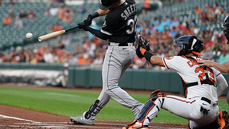 Aug 24, 2022; Baltimore, Maryland, USA; Chicago White Sox outfielder Gavin Sheets (32) hits a two run RBI single in the first inning against the Baltimore Orioles at Oriole Park at Camden Yards. Mandatory Credit: Mitch Stringer-USA TODAY Sports